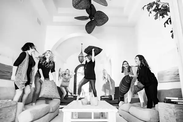 Jessika and friends jumping on a couch
