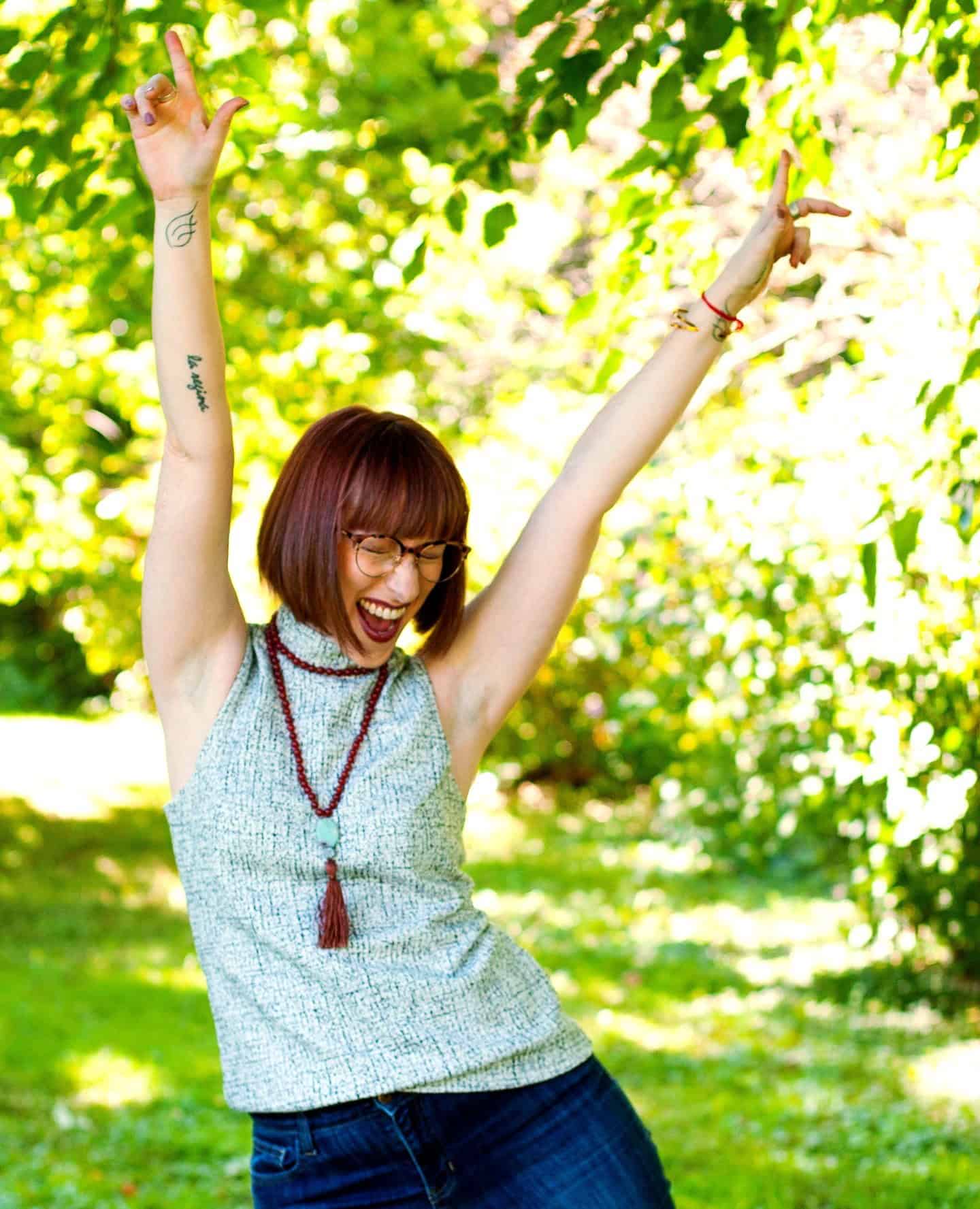 Bri Seeley hands in the air smiling