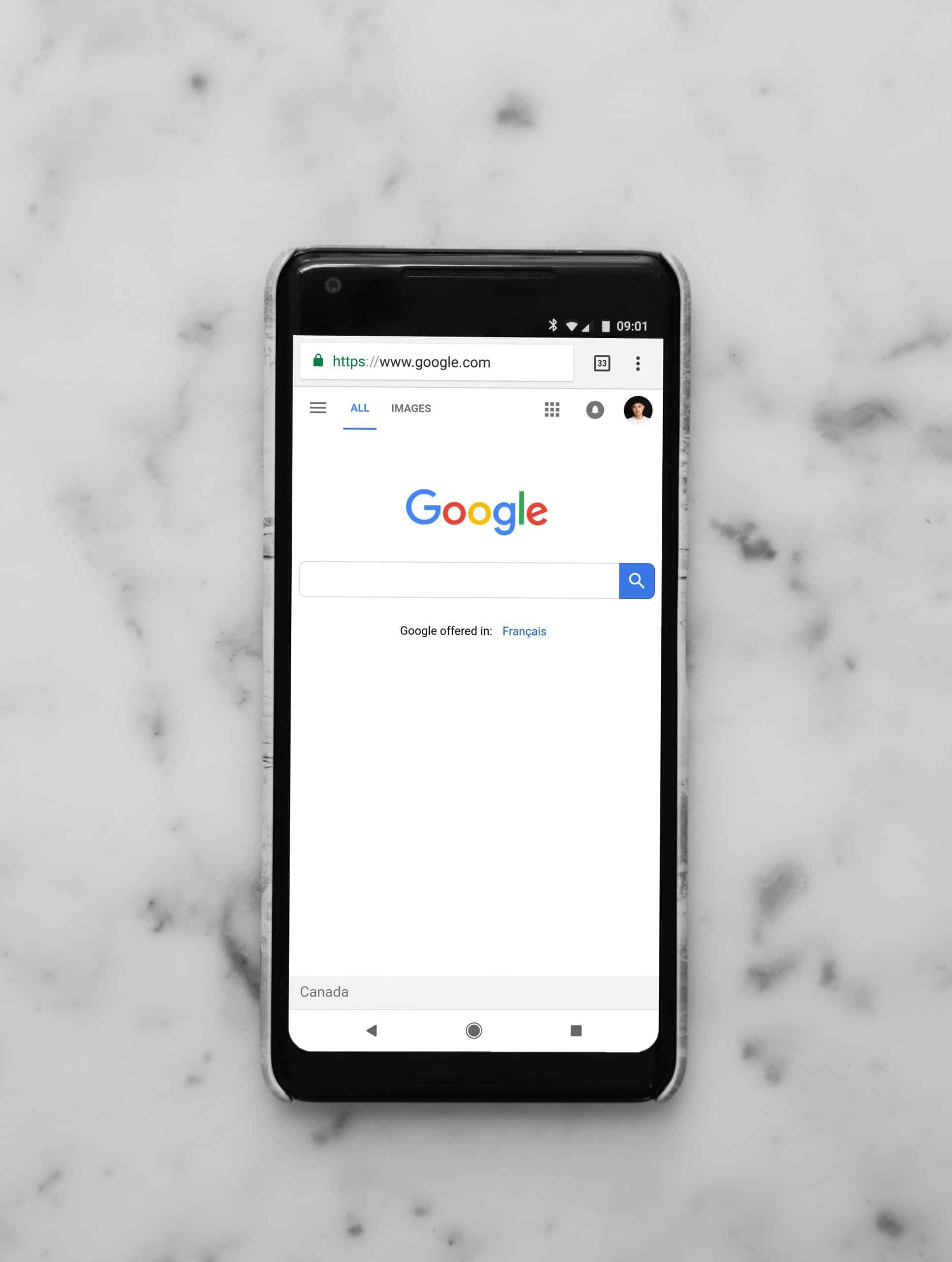 Google on iphone on a marble table-2