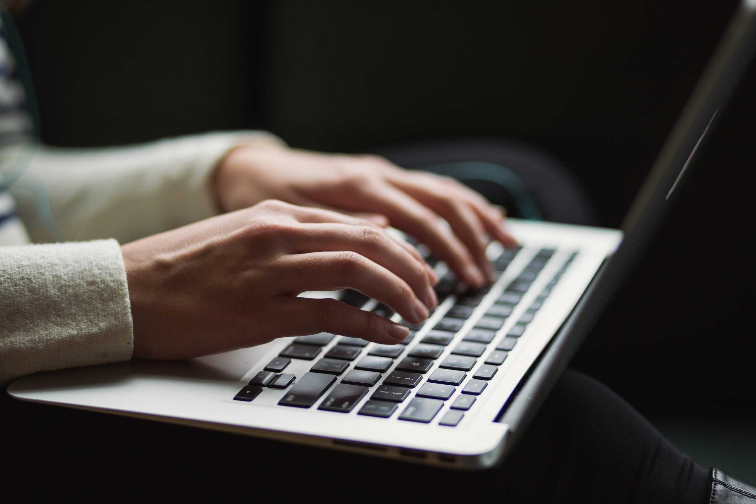 Hands typing on a keyboard-1