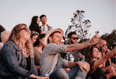 Crowd of people recording a concert